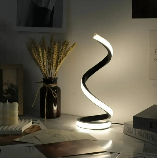 Spiral LED table lamp cool white glow on desk, black body