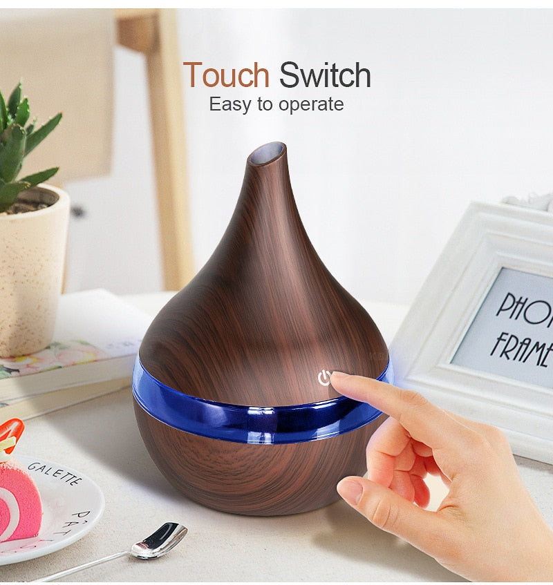 Touch switch on dark wood ultrasonic desk diffuser for easy desk use