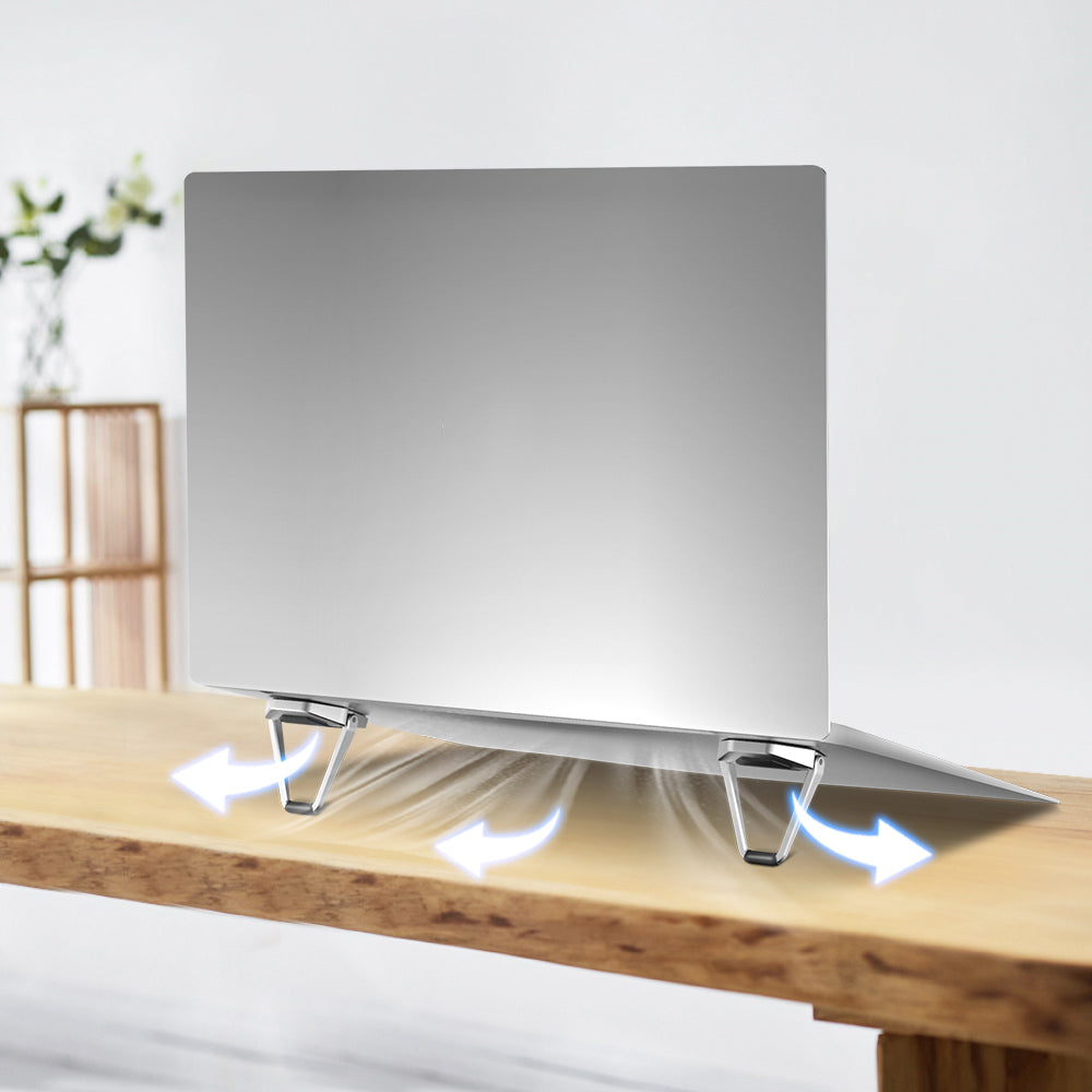 Airflow gap under laptop created by triangular metal stands