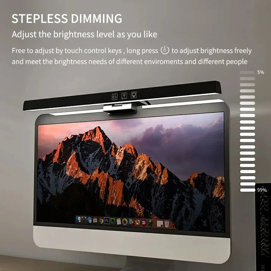 Computer monitor with stepless dimming feature and mountain-themed wallpaper.